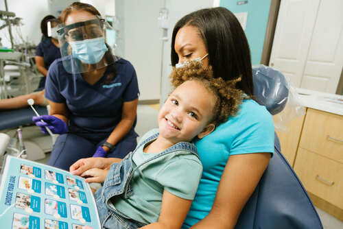 Dental patient learning about preventive dental care
