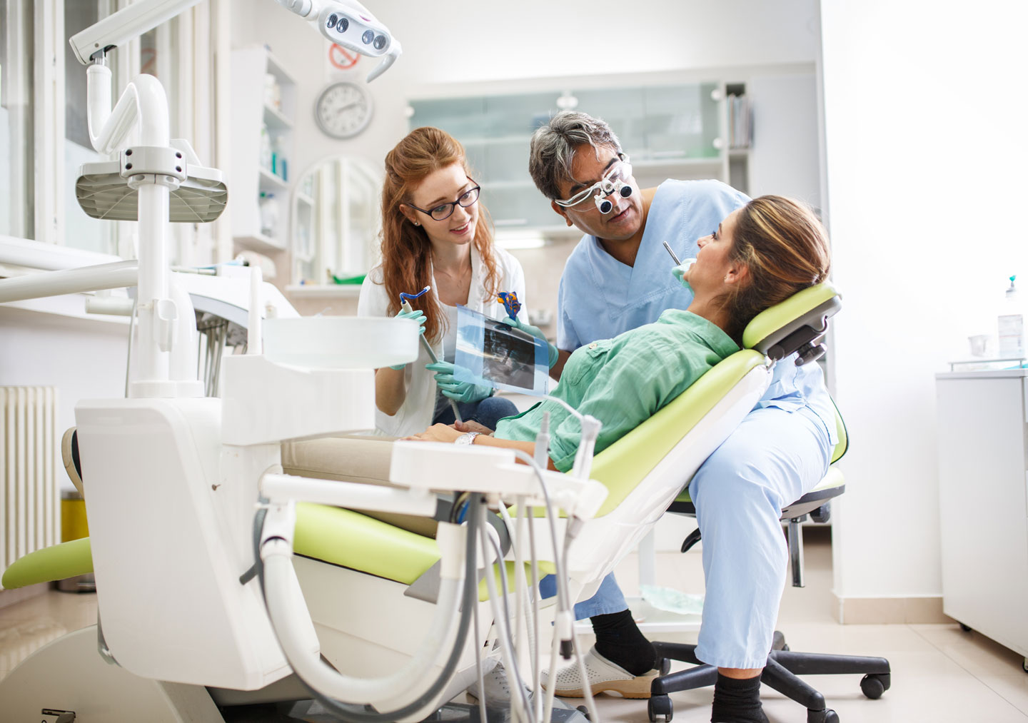 Dentist explaining the basics of Oral Cancer prevention