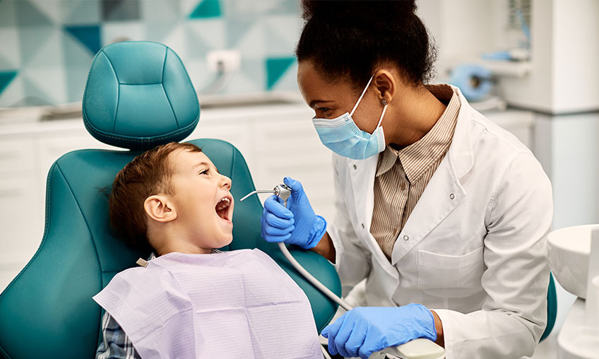 provider and child at dental appointment