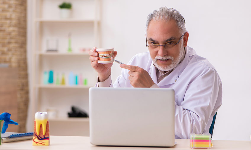 provider showing how to care for dentures