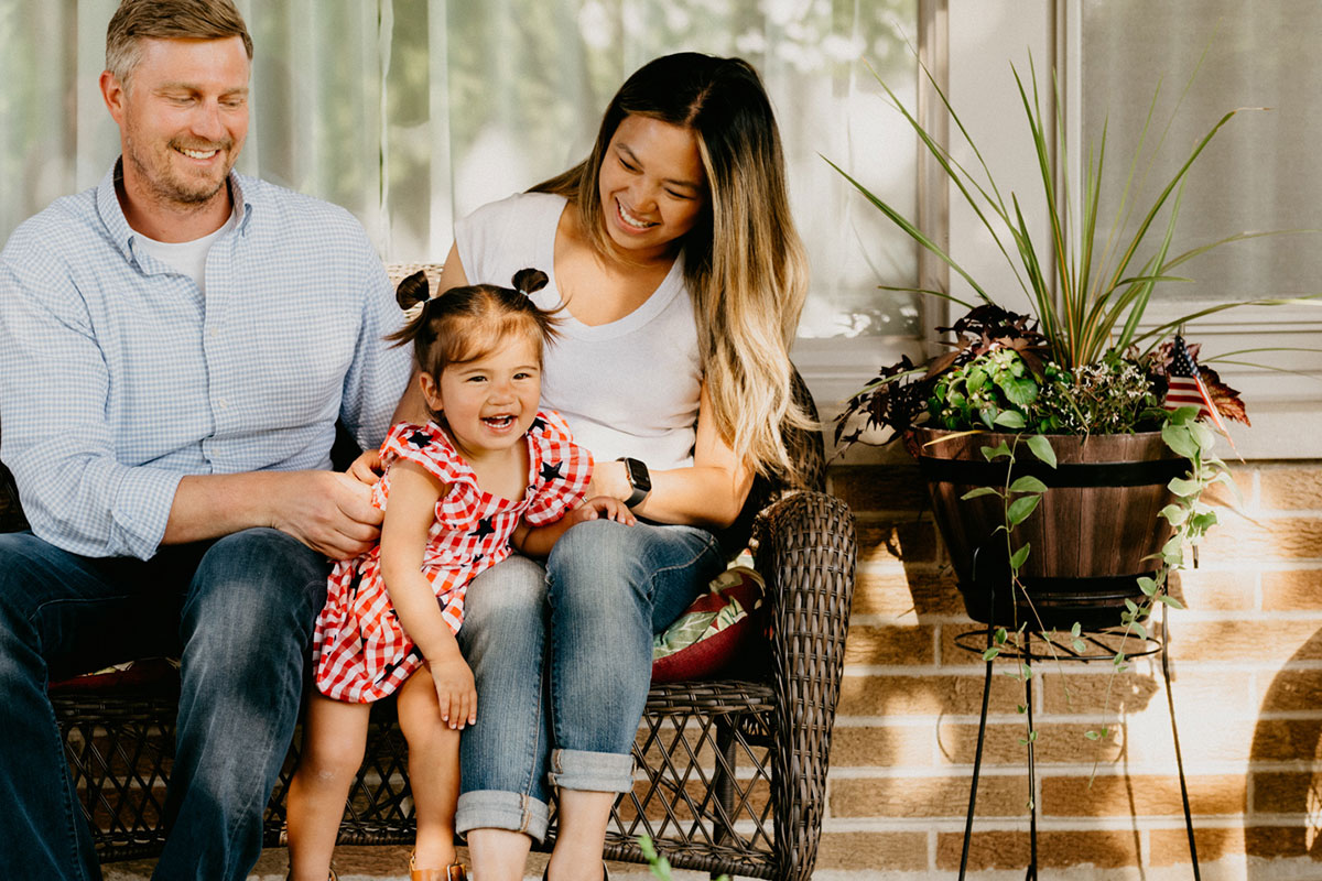 Smiling Family Learning About Affordable Dental Plans