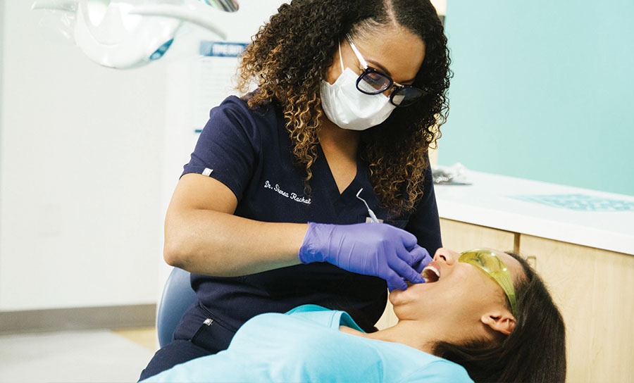 Dental provider during a teeth cleaning session