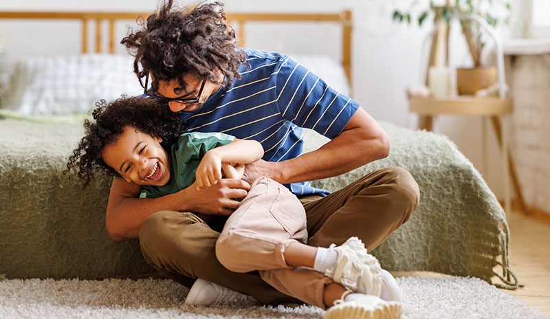 Father and son excited about having great oral health