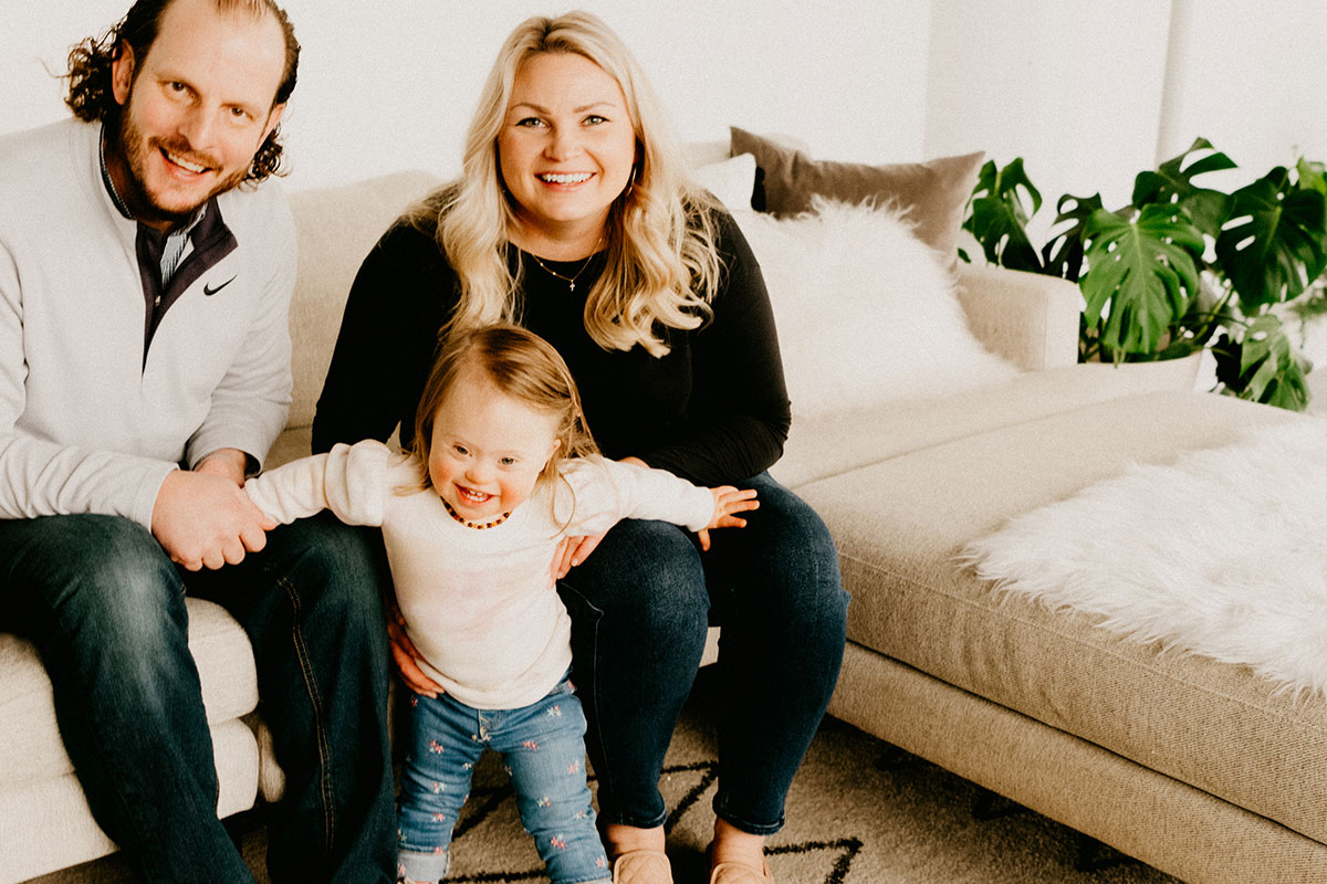 happy family sitting on couch