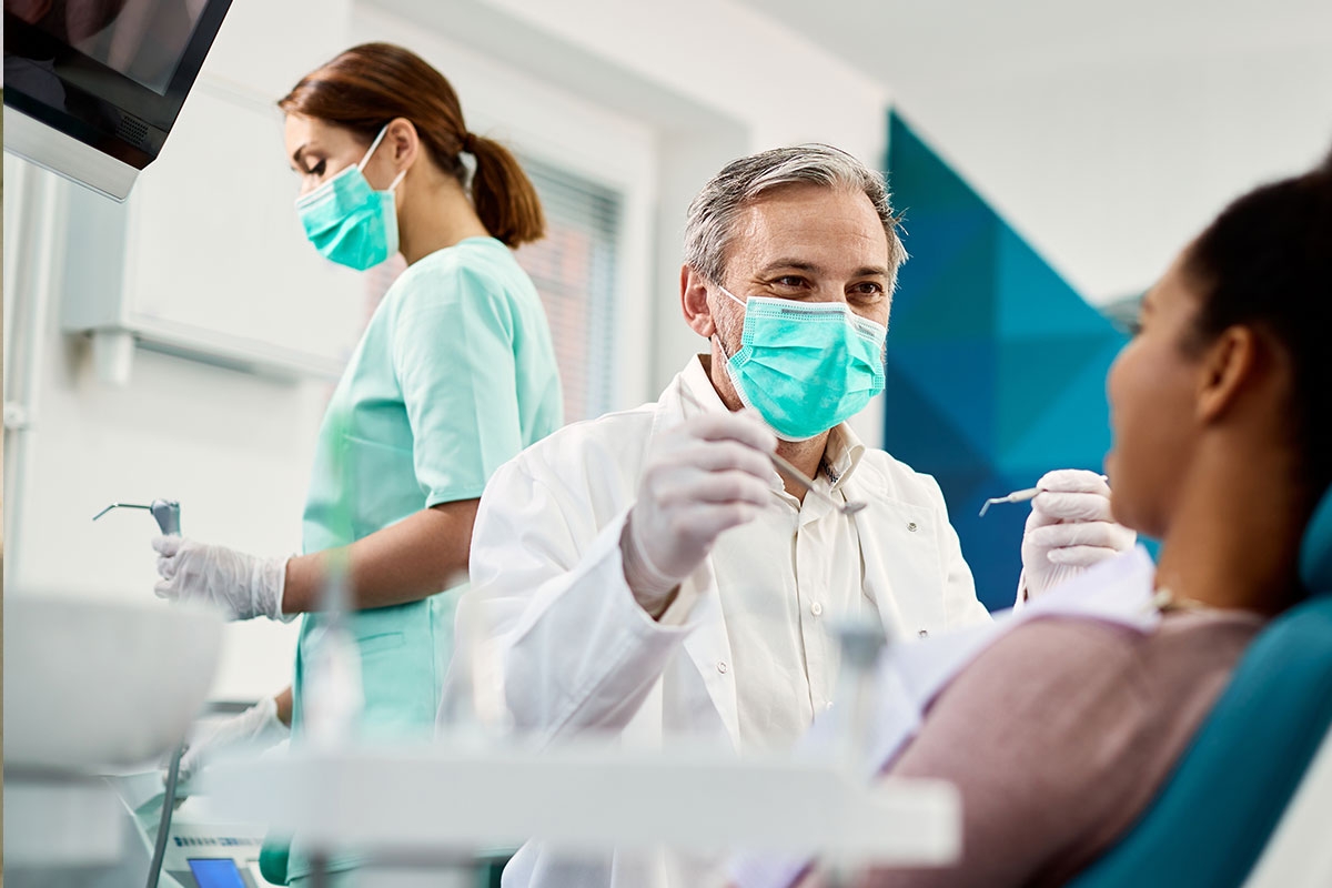 dental provider with patient