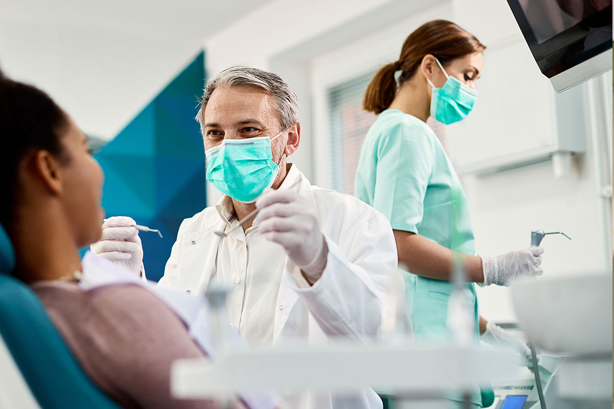 Dentist with patient