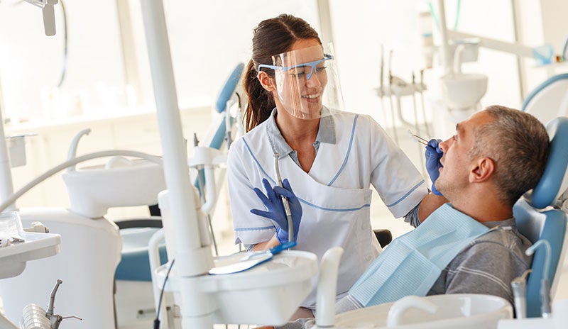 Dentist with patient Dentist with patient